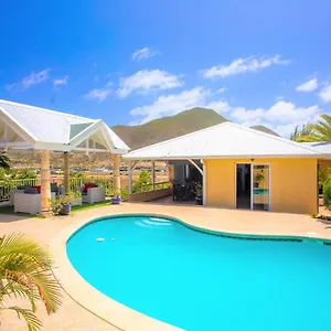 https://spacious-villa-with-ocean-and-mountain-view-4-beds.comcaribbean.com